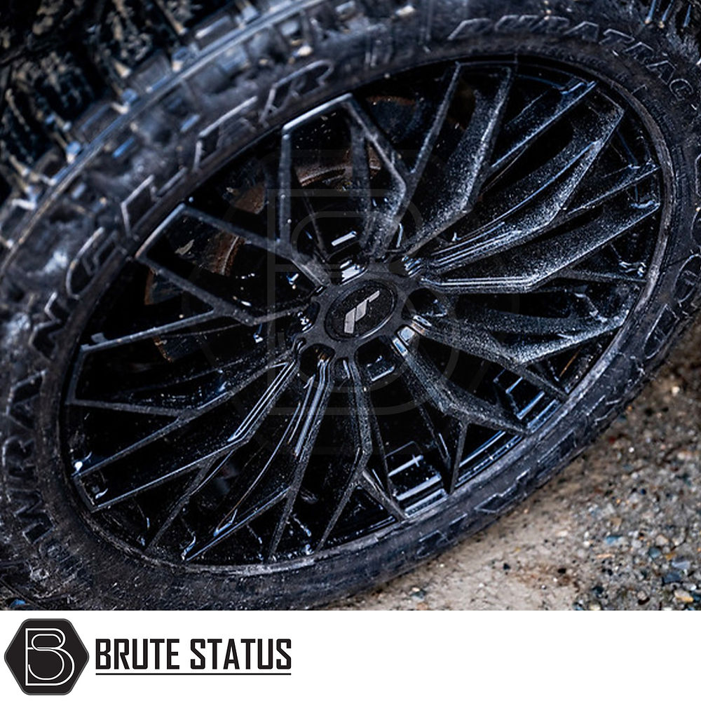 Close-up of JR Wheels JRX12 tire, showcasing tread and rim details, suitable for customization of pick-up trucks with a sleek, machined tinted face design.