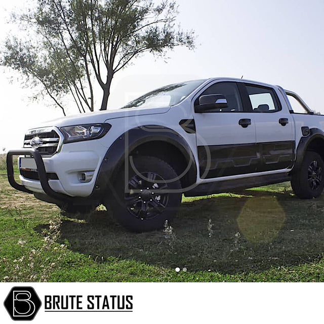 Ford Ranger 2012-2022 Bull Bar (Nudge Bar) Matt Black on parked white truck; enhances look, protects bumper, with easy installation and no drilling needed.