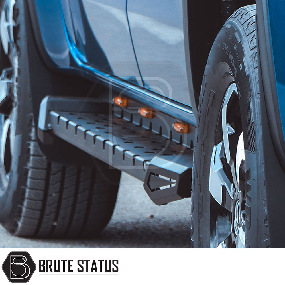 Volkswagen Amarok 2010-2017 Heavy Duty M30 Steel Side Steps, emphasizing sturdy steel design with matt black finish, shown close up on a blue vehicle.