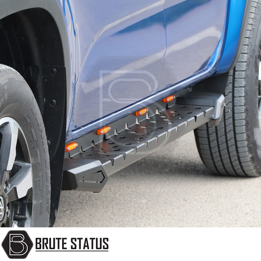 Mitsubishi L200 Series 5 Heavy Duty M30 Steel Side Steps with LEDs, featuring robust design and easy installation, shown close-up on a blue truck.