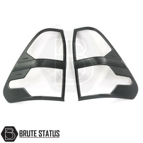 Toyota Hilux 2016-2020 Taillight Covers in black ABS plastic, featuring easy installation with pre-applied adhesive tape, designed for a custom look.