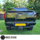 Nissan Navara NP300 2015-2022 LED Tail Lights, aftermarket units enhancing truck aesthetics with smoked design and LED technology, shown on a parked black truck.