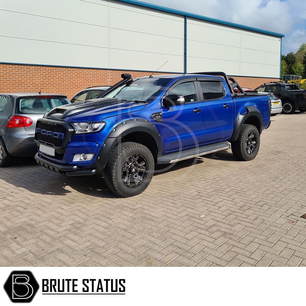 Ford Ranger 2011-2018 32mm Front Shock Spacers shown in a truck, highlighting robust, heat-treated studs and nuts for enhanced suspension lift performance.