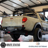 Mitsubishi L200 Series 4 2006-2009 Wide Arch Kit (Overland Extreme) in a garage, showcasing premium wheel arches designed for durability and style.