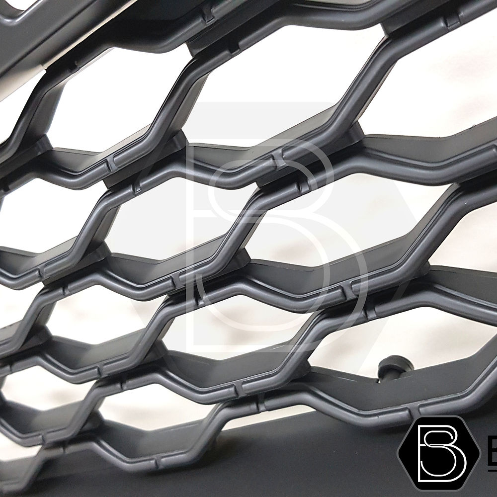 Close-up of a Ford Ranger 2019-2022 Black Grille with White LEDs for Wildtrak, featuring smooth black finish and Raptor-inspired design.