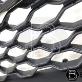 Close-up of a Ford Ranger 2019-2022 Black Grille with White LEDs for Wildtrak, featuring smooth black finish and Raptor-inspired design.