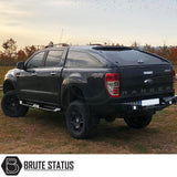 Fiat Fullback 2015-2019 Heavy Duty S32 Steel Side Steps in matt black, showcased on a parked black truck, highlighting durability and sleek design.