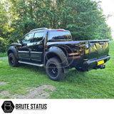 Nissan Navara NP300 2015-2022 LED Tail Lights on a black truck parked on grass, showcasing aftermarket styling and easy installation features.