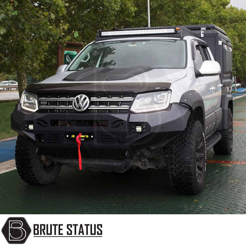 VW Amarok 2017-2022 Heavy Duty Winch Front Bumper with LED lights, designed for tough situations, visible on a parked truck, suitable for professional fitting.