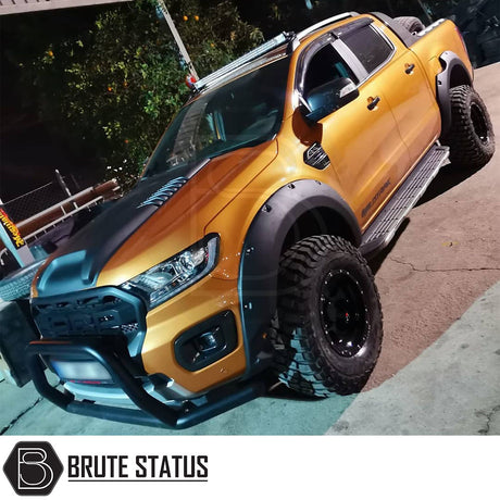 Ford Ranger 2019-2022 Park Assist Wide Arch Kit, riveted style, shown installed on a yellow truck, highlighting the premium wheel arches and vehicle enhancement.