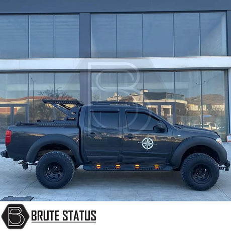 Nissan Navara D40 2006-2014 Bonnet Scoop on a black truck, showcasing its durable ABS plastic construction and sleek design for enhanced vehicle individuality.