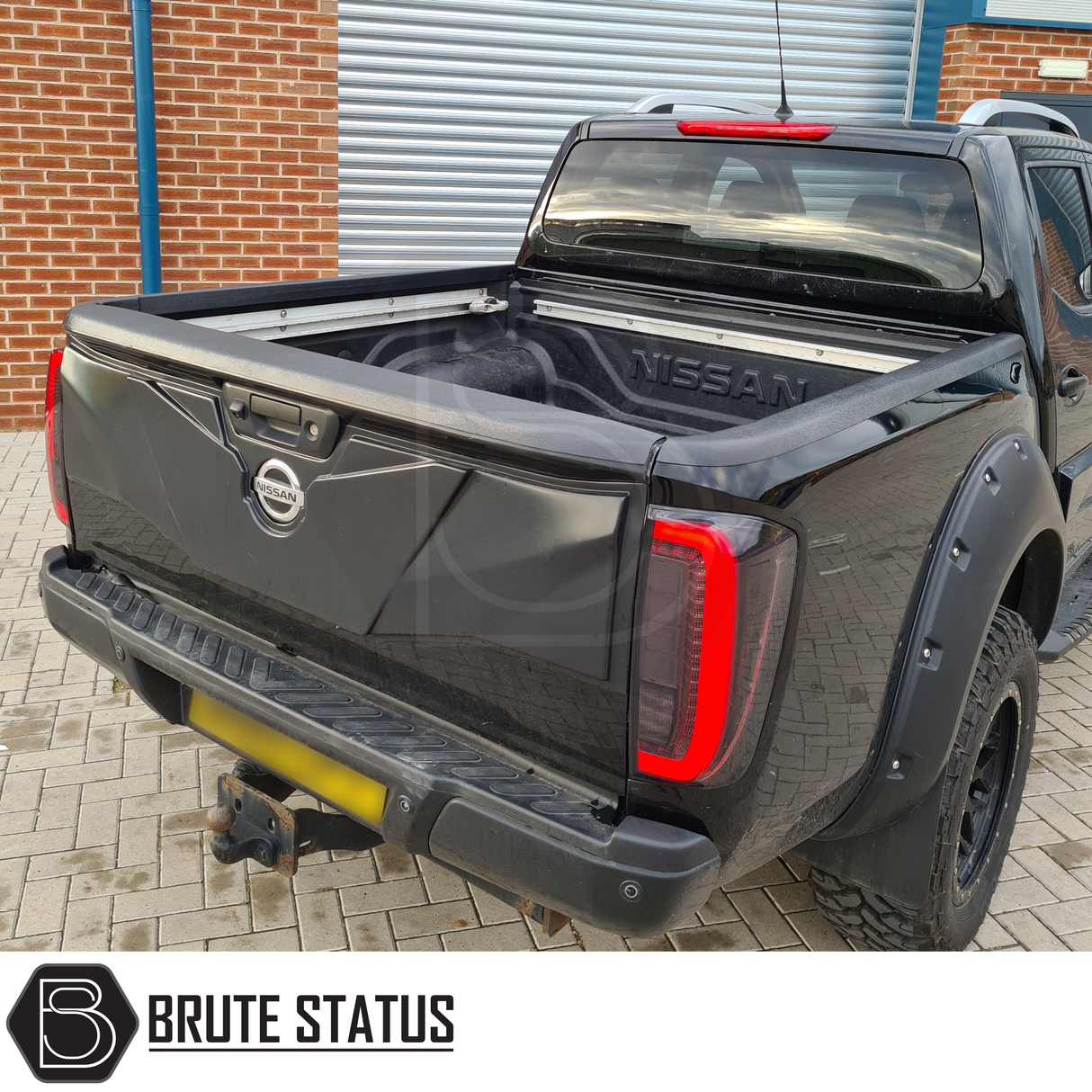 Nissan Navara NP300 2015-2022 Tailgate Cladding Cover/Protector Matte Black, offering durable ABS plastic protection, fits seamlessly with double-sided tape for easy installation.