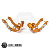 Mitsubishi L200 Series 5 2015-2019 2.5 Lift Kit, featuring orange metal shock spacers and heavy-duty rear lift shackles for enhanced truck elevation.