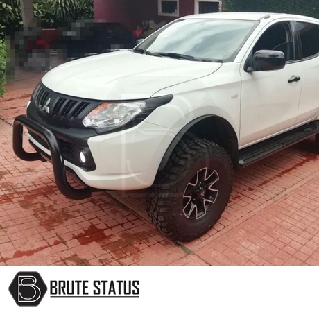 Mitsubishi L200 2015-2019 Bull Bar (Nudge Bar) in matt black, enhancing truck front with durable stainless steel protection, shown on a parked vehicle for visual reference.