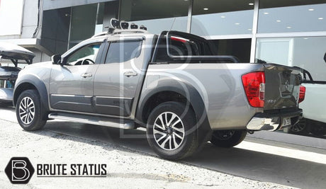 Nissan Navara NP300 2015-2022 Bonnet Guard and Window Wind Deflector Bundle displayed on a grey truck, highlighting protective and stylish aftermarket accessories.