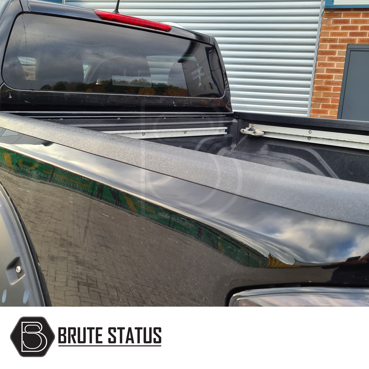 Nissan Navara NP300 2015-2022 Load Bed Rail Protector Set on a black truck, designed for easy installation with impact-resistant ABS plastic.