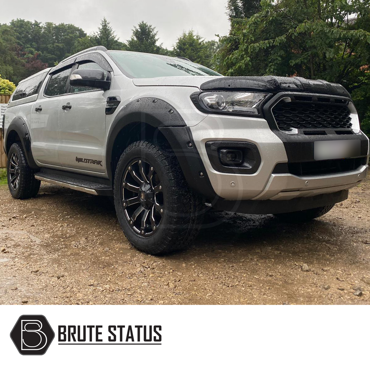 Ford Ranger 2019-2022 Wide Arch Kit (Riveted Style) displayed on a parked white truck, showcasing its robust design and transformative impact on vehicle aesthetics.