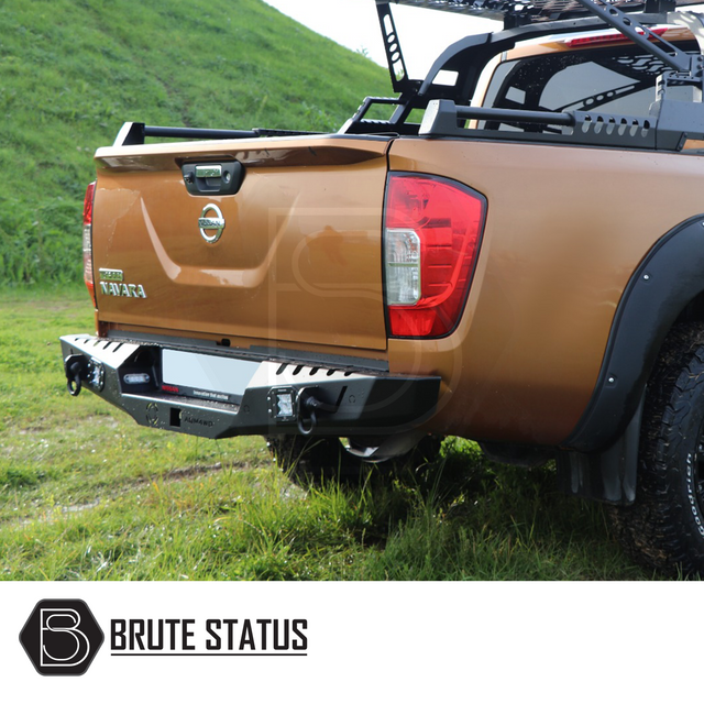 Nissan Navara D40 2010-2015 rear bumper in matt black, featuring integrated lights and sensor-ready design, enhancing style and durability for pick-up trucks.