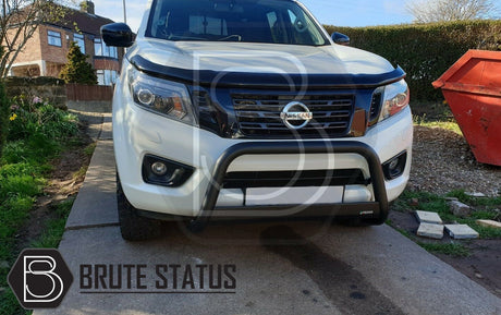 Nissan Navara NP300 2015-2022 Bonnet Guard and Window Wind Deflector Bundle showcased on a white truck, highlighting their sleek, durable, and aerodynamic design.