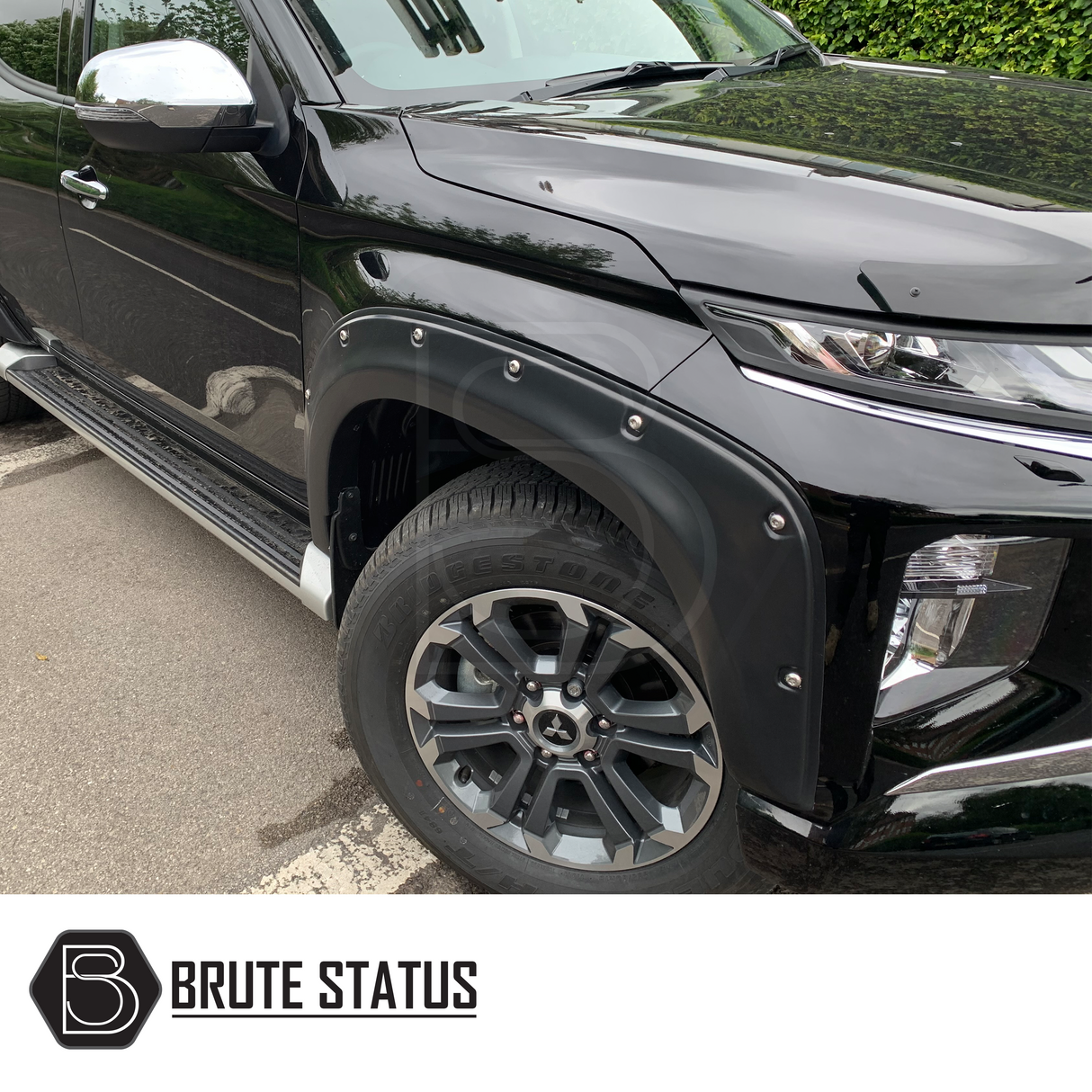 Mitsubishi L200 Series 6 2019+ Fender Flares on a black vehicle, showcasing rugged design and fit for double cab models, enhancing truck's appearance and protection.