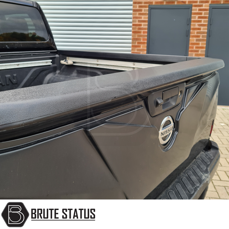 Nissan Navara NP300 2015-2022 Tailgate Cladding Cover/Protector, matte black, offering durable ABS plastic protection, easily fitted with tape, enhancing truck's style and resilience.