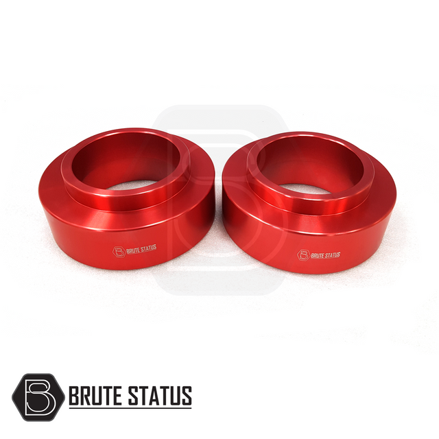 Nissan Navara NP300 2015-2022 Rear Shock Spacers 50mm, red metal rings designed for enhanced truck lift, crafted from durable anodized 6061-T6 aluminium.