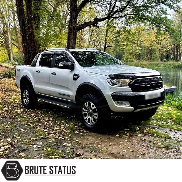 Ford Ranger 2015-2022 T7 T8 Wide Arch Kit - Slim Style, enhancing a truck's appearance with sleek fender flares, shown on a parked white truck by water.